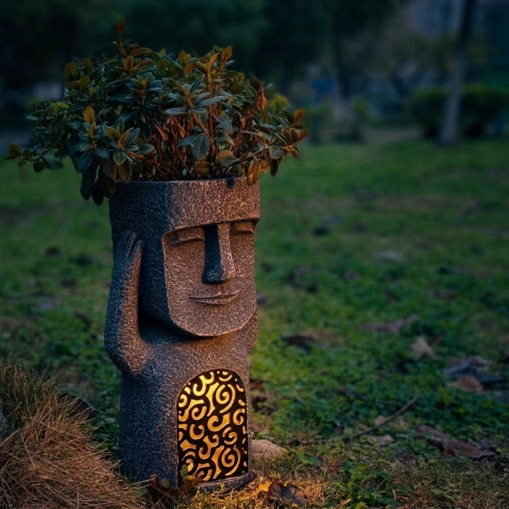 Abstract face planter with solar LED in a home setting