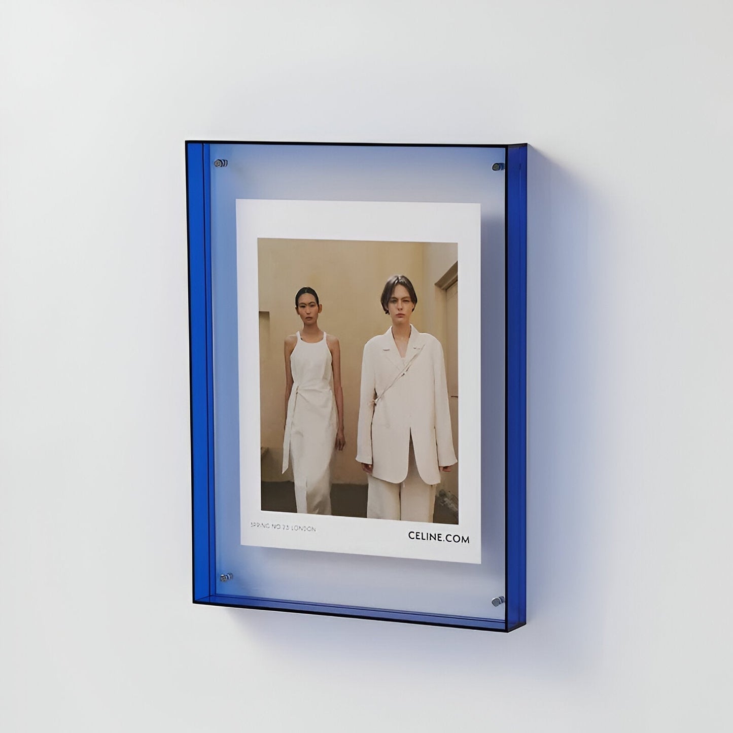 Clear acrylic floating picture frame shown from the side