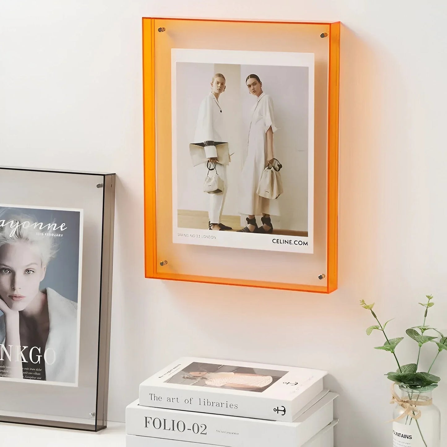Clear acrylic floating picture frame shown on display